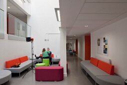 Contemporary designer sofas and stools in the waiting area of a modern college (Oxford and Cherwell Valley College)