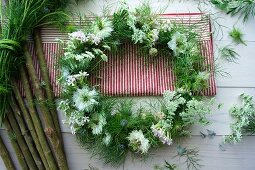 Wreath made of nigella, cow parsley, and soft-pink mini-carnations