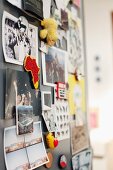 Postcards and photos on magnetic pinboard