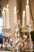 Crystal candlestick with lit candles