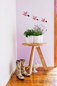 Rustic flower table; three flying parrots on the wall