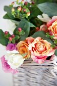 Bouquet of roses in white wicker basket