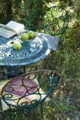 Vintage garden table and chairs made of rusty metal