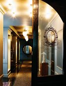 Stylish hallway with antiques and wall mirror (Hotel De Ville)