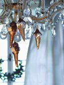 Baubles shaped like ice-cream cones hanging from chandelier