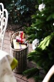 Small Christmas presents in wicker basket