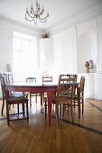 White dining room with a handmade table in a former monastery