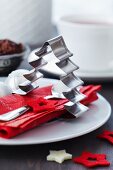 Christmas-tree-shaped pastry cutter used as napkin ring