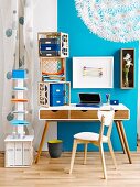 Vintage desk against blue wall; stacked crates and shelving column used as mobile storage solutions