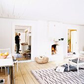 White interior of country house with open fireplace