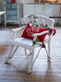 Festively decorated white wooden chair