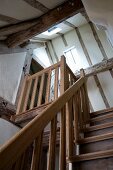 Wooden staircase leading to attic in restored half-timbered house