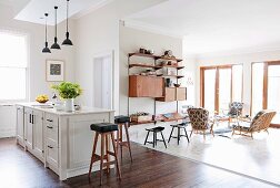 Open-plan interior with furniture in style of 1950s and 60s