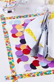Place mat decorated with washi tape and confetti