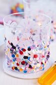 Tealight holder decorated with confetti