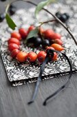 Wreath of rose hips and chokeberries on napkin