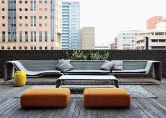 Inviting group of designer seating on loft-apartment terrace with view of cityscape in Johannesburg, South Africa