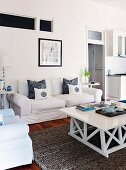 Sofa and white-painted coffee table in rustic living room