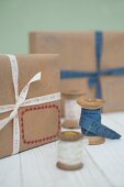 Wooden reels and simply wrapped packages with ribbons