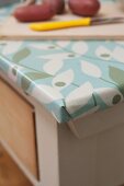 Rustic kitchen table covered in oilcloth
