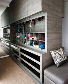 Custom-made, cubic cupboard element in dressing area with drawers, pigeon holes for accessories and closed top unit