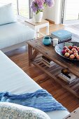 Rustic wooden coffee table next to sofa