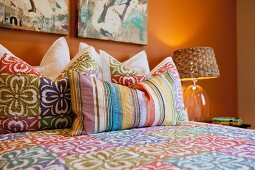 Throw pillows arranged on bed; Azusa; California; USA