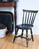 Vintage kitchen chair made from dark wood with turned legs