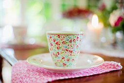 Floral breakfast cup and saucer on linen napkin