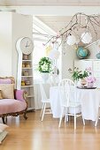 White dining set next to rustic long-case clock with integrated shelves next to Baroque-style sofa
