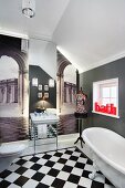 Bathroom visually enlarged by wallpaper murals of archways leading to city squares and large mirror; lettering reading 'Bath' as bright red accent