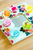 Mirror with frame decorated with floral paper and hand-crafted paper flowers