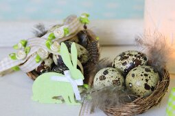 Easter nests with speckled eggs decorated with felt bunny