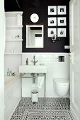 Small bathroom with subway tiles, charcoal wall and decorative floor tiles