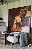 Vintage standard lamp, antique armchair and oil painting of horse