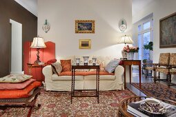 Traditional living area with Oriental rugs and antique furniture of various styles