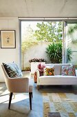 Summery living room with bright furniture, open patio door