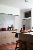 Rustic kitchen with terracotta floor tiles and glazed wall tiles