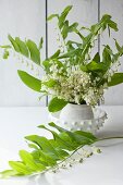 Vase of lily of the valley and white-flowered Solomon's seal