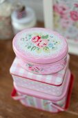 Romantic pink tins with floral patterns