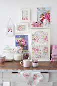 Cabinet and pictures of roses decorating shabby-chic kitchen table