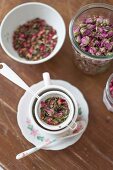 Brewing an infusion of dried rose petals