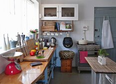 Simple table opposite kitchen counter in rustic kitchen