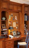 Solid-wood fitted cabinets with shelves and integrated desk in country-house style