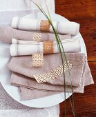 Linen napkins with delicate napkin rings made from cherry wood