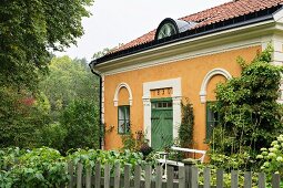 Traditional country house with yellow-painted façade