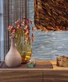 Pendant lamp with lampshade covered in brown feathers
