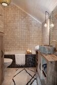 Mosaic tiles and rustic washstand in Oriental attic bathroom