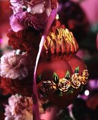 Red, heart-shaped Christmas tree bauble with rose motif on carnation wreath