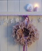 Wreath of feathers & satin ribbon as Christmas decoration